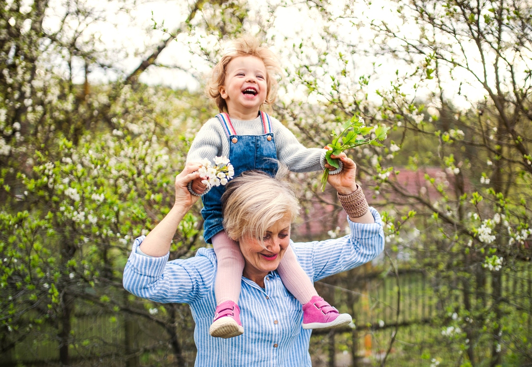 Grandmother and toddler in nature